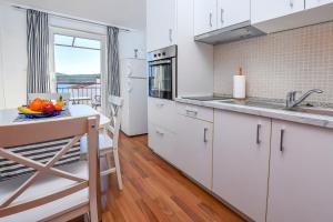 Kuchyň nebo kuchyňský kout v ubytování Apartments Vladimir + 18 fotografií