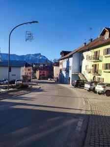 an empty street with a street light and buildings at Casa vacanza azzurra Lavarone in Lavarone