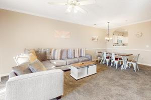 a living room with a couch and a table at Catalina Cove in North Myrtle Beach