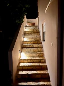 a set of stone stairs leading up to a building at Thalia Apartments in Agia Galini