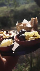 a table with three bowls of food on it at Hospedaje Finca la Encantada in Seclantás