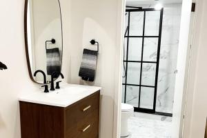 a bathroom with a sink and a mirror and a toilet at The Phenix Historic DTWN Hotel, King Bed, Room # 311 in Bangor +13 photos