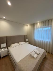 Ένα ή περισσότερα κρεβάτια σε δωμάτιο στο Brittos Home Lovely Stay - Villa Family in VN Famalicão