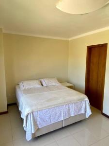 Ein Bett oder Betten in einem Zimmer der Unterkunft Excelente casa na Praia do Cassino, RS