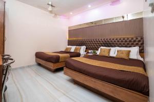 Postel nebo postele na pokoji v ubytování Hotel Royce Executive Near US Consulate, Bandra Kurla Complex