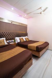 Postel nebo postele na pokoji v ubytování Hotel Royce Executive Near US Consulate, Bandra Kurla Complex