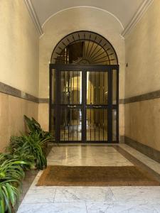an entrance to a building with a black door at Scipioni Vatican Suite in Rome