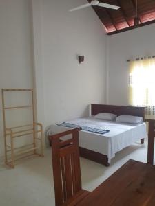 Ένα ή περισσότερα κρεβάτια σε δωμάτιο στο Nature guesthous