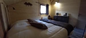 Postel nebo postele na pokoji v ubytování Chalet le p'ti lu