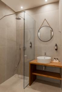 a bathroom with a shower and a sink at DK APARTMENTS in Ioannina
