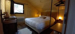 Postel nebo postele na pokoji v ubytování Chalet le p'ti lu