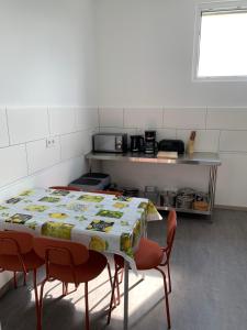 a table in a kitchen with a tablecloth on it at Hochstrasse 10 in Unna