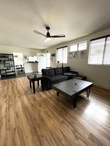 a living room with a couch and a table at Spacious 1 bedroom less than 1 mile to Beach & DT in Huntington Beach