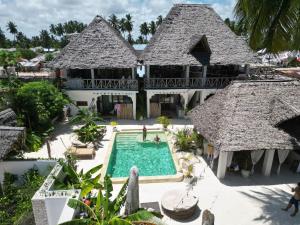 an aerial view of a resort with a swimming pool at Olamanga Beach Villa in Jambiani