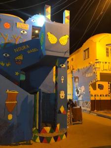a exhibit of a play structure with a painting on it at Noura hasel nubian house in Aswan