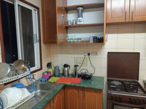 مطبخ أو مطبخ صغير في Lakeside 2 Bed En-Suite- Milimani