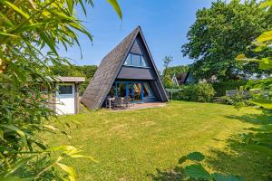 Zahrada ubytování Lütt Hus - Zeltdachhaus in Strandnähe