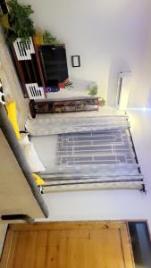 a room with a bed on the floor in a room at F&D villas in Dar es Salaam