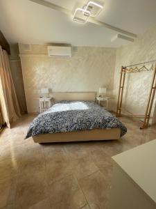 Ένα ή περισσότερα κρεβάτια σε δωμάτιο στο L'Orizzonte