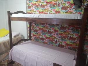 Uma ou mais camas em beliche em um quarto em Casa Da Lucia
