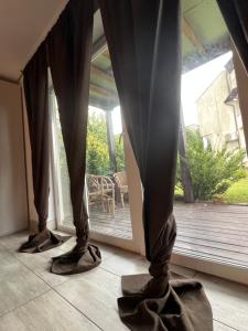 a pair of shoes standing in front of a window at HELLO House in Alytus