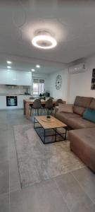 a living room with a couch and a table at Apartamento Sofia in Santa Pola