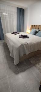a bedroom with a large bed with two pillows on it at Apartamento Sofia in Santa Pola