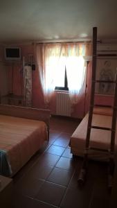 Кровать или кровати в номере Villa Asinara