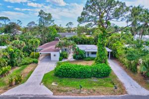 an aerial view of a house with a driveway at Sunny Naples - Subtropical Oasis Cottage in Naples