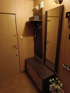 a bathroom with a dresser with a mirror on it at Mieszkanie 2pokojowe in Wieliczka