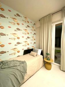 Voodi või voodid majutusasutuse Aquarium Apt SML Parcheggio Gratis Terrazzo toas