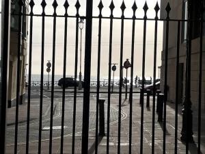 a wrought iron fence in front of a street at City Centre Seaview Apartment in Brighton & Hove