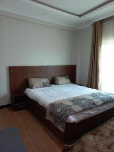 Un pat sau paturi într-o cameră la G&19 Apartment