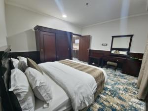 Een bed of bedden in een kamer bij قصور الشرق Qosor Al Sharq