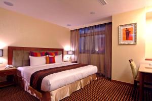 A bed or beds in a room at Jingan Classic Inn