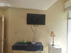 a room with a tv on the corner of a wall at Ocean view superior in Juan Pedro