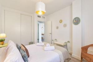 Posteľ alebo postele v izbe v ubytovaní Nice Apartment Huelin