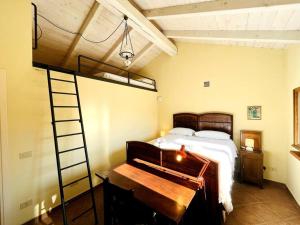 a bedroom with a bunk bed and a ladder at Casa Mina(Wi-fi & TV) in Serralunga di Crea