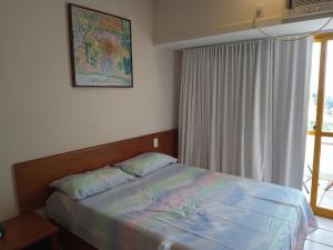 Giường trong phòng chung tại Studio Vista ao Mar +4 ảnh