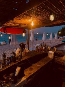 a bar on the beach with a view of the beach at ROCHA BEACH CLUB in Barú