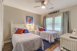 a bedroom with two beds and a window at 3009 Cameron in Isle of Palms