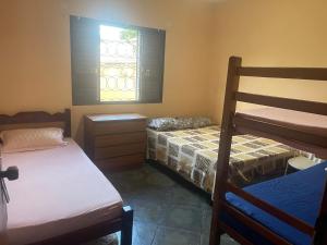a bedroom with two bunk beds and a window at Lu in Itu