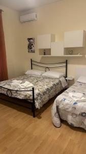 Säng eller sängar i ett rum på CASA GEMELLI GEMELLI