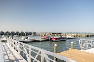 a group of boats docked at a dock at Blufin Bungalows & Marina in Chincoteague