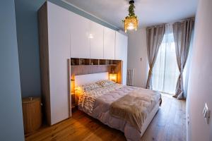 Postel nebo postele na pokoji v ubytování Glam Turin Apartment