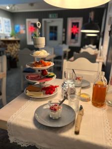 a table with plates of food on top of it at Norwegian Wild in Vangsvik