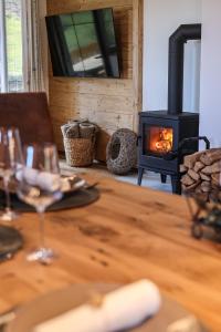 a wooden table with a wood stove in a room at Ferienwohnung Söldenköpfl-Blick in Schönau am Königssee