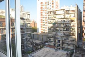 a view from a window of a city with tall buildings at Regatas Las Cañitas Suites in Buenos Aires