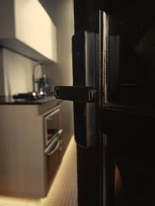 a close up of a door in a kitchen at Loft Sagitárius - Central Zone - Lotk1 in Rio de Janeiro