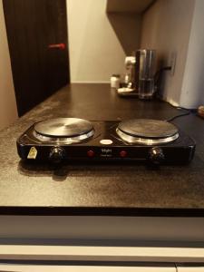 a stove top with two burners on top of a counter at Loft Sagitárius - Central Zone - Lotk1 in Rio de Janeiro